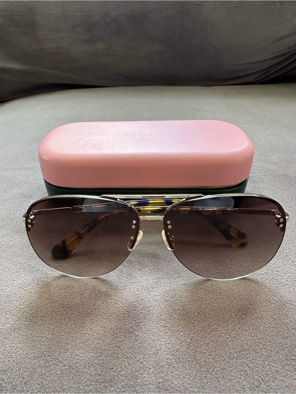 kate spade gold-frame aviator sunglasses with brown lenses and pink case